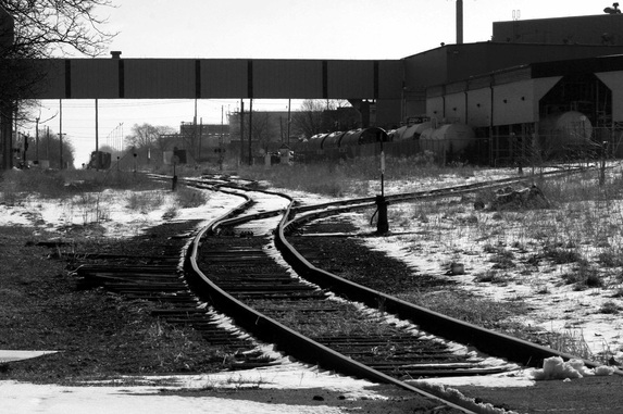 FreePhotoCourse.com Contributor's Photo Gallery; Submit Your Photos like this one and we may post it for the world to see.  Windsor, Ontario train tracks behind Hiram Walker / Wisers whiskey distillery.  (c) 2011, all rights reserved.