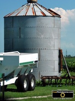 Farm scene - steel silo and old fashioned plough. Find more cool pictures and wallpapers at FreePhotoCourse.com. © 2011, all rights reserved. 