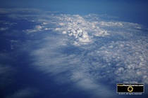 Picture of cloud cover as seen from above in a jet at cruising altitude.  www.FreePhotoCourse.com has more great desktop wallpapers and high-res pictures...for free! © 2011, FreePhotoCourse.com; all rights reserved. 