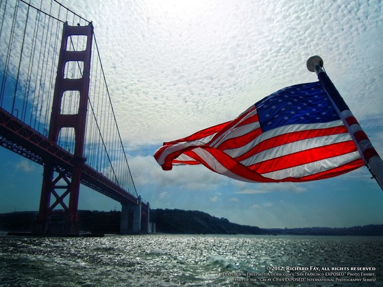 Patriotic picture of San Francisco Bay, with the Golden Gate Bridge and an American flag.  Special Effects picture of the San Francisco skyline in 180 degrees, photographed and created by Steven Shapall. Part of the online artistic photography exhibit, 