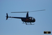 Picture of a navy blue helicopter against a blue sky;© 2011, FreePhotoCourse.com, all rights reserved.  Free high-res desktop wallpapers and pictures.   