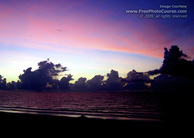 Picture of a colorful sunset over the Pacific Ocean. Download free pictures and wallpapers.  © 2011, FreePhotoCourse.com, all rights reserved.  