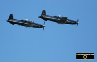 Picture of two WW2 RCAF Mustangs in Acrobatic Air Show.  Find More Awesome Free Pictures at www.FreePhotoCourse.com