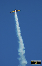 Picture of Team Breitling's high speed airplane in the Red Bull Air Races over Windsor, Ontario, Canada. Piloted by Nigel Lamb.  ©2010, FreePhotoCourse.com 