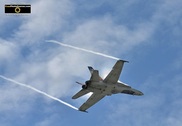 Picture of a CF18 Fighter Jet with Vapor Trails off the Wings. © 2011, FreePhotoCourse.com, all rights reserved.  Free high-res desktop wallpapers and pictures.  