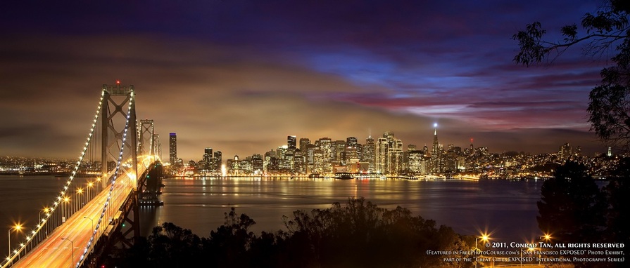 Stunning nighttime long-exposure picture of the San Francisco waterfront, shot from Yerba Buena Island (Treasure Island). Part of the online artistic photography exhibit, 