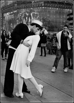 Modern-day version of the famous 1945 LIFE magazine 'The Kiss' photo featuring a sailor kissing a nurse in Times Square on VJ Day in 1945.  This photo was taken by Leon Hertzson in 2010 on the Father Duffy traffic island.  Part of the NYC Exposed photography exhibit by http://FreePhotocourse.com; all rights reserved