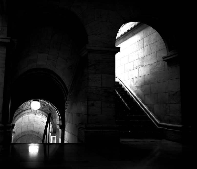 Black & White picture of interior stairwells in New York City Library; part of NYC Exposed online exhibit from www.FreePhotoCourse.com; © 2011, Mathew Spolin 