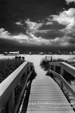 Picture of a beachfront and boardwalk cross-over on Treasure Island.  Photography by Stephen Kristof, © 201; published by www.FreePhotoCourse.com, all rights reserved. 